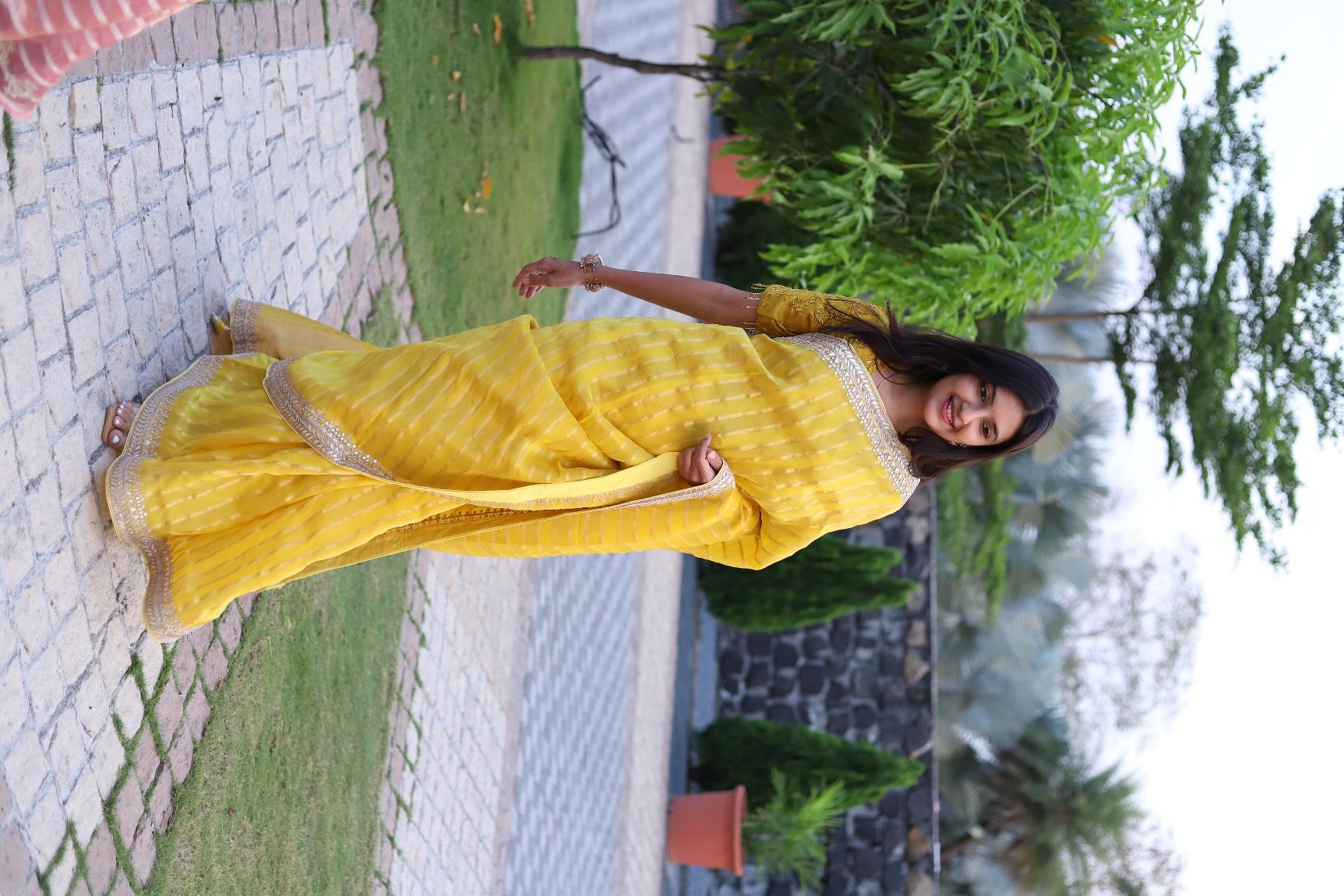 Traditional kanjivaram silk saree in vibrant mustard yellow with contrasting border